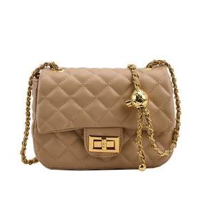 Beige quilted leather crossbody bag with gold chain strap and adjustable metal ball