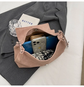 Pink chain tote bag interior showing large capacity for tablet, phone, and essentials