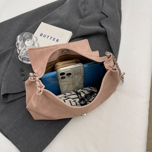 Top view of pink tote bag capacity showing tablet, phone, wallet and umbrella
