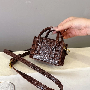 Chic brown crocodile pattern mini handbag with gold hardware and shoulder strap