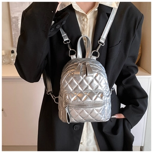 Silver metallic mini quilted backpack for women featuring stylish diamond stitching