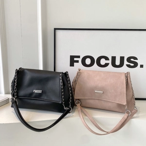 Minimalist leather chain tote bags in black and pink apricot with metallic accents