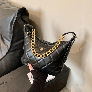 Black quilted crescent shoulder bag with gold floral buckle and chain strap