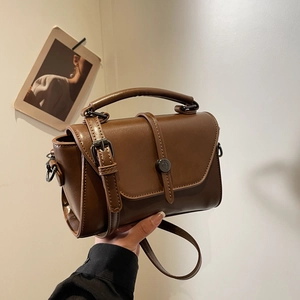 Retro warm brown leather crossbody bag with flap and bronze buckle hardware