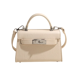 Chic cream white textured leather Kelly style handbag with silver hardware and shoulder strap