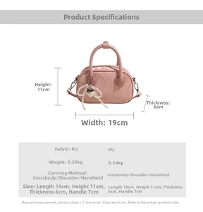 Detail showing pink marble texture PU leather handbag with heart pearl charm and metal strap