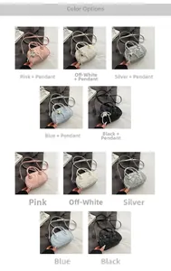 Detail view of stylish velvet textured handbags in multiple colors with heart pendants