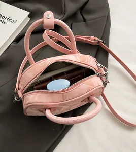 Top view of pink marble pattern handbag interior showing storage capacity for phone and wallet