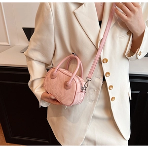 Pink marble pattern mini handbag with heart charm detail and matching shoulder strap