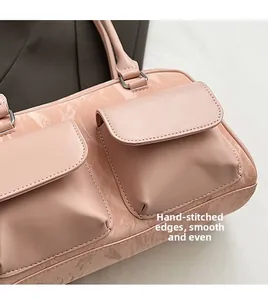 Close-up of pink marble pattern PU leather handbag with detailed handmade stitching details