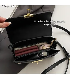 Top-down view of black leather shoulder bag showing spacious interior compartments and capacity