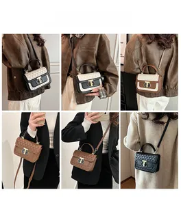 Detail view of the elegant crossbody bag with quilted texture and golden metallic lock