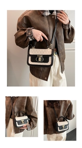 Detail of vintage bicolor crossbody bag with geometric embossing and gold metal lock