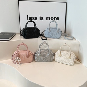 Elegant set of 5 velvet-textured handbags in various colors with heart charms and straps