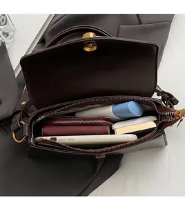 Top view of deep brown baguette bag interior showing spacious compartments and storage
