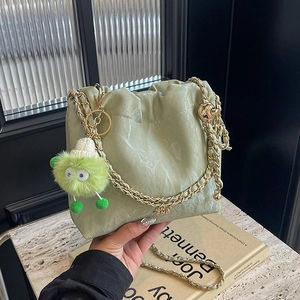 Pleated PU Leather Bucket Bag Drawstring Shoulder Bag With Metal Chain And Plush Monster Charm Summer Chic Crossbody Bag For Women