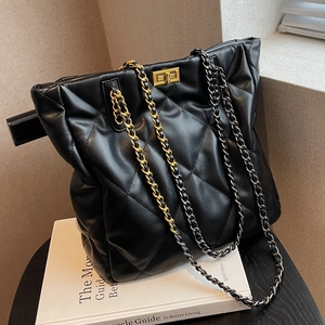 Black quilted chain tote bag with high-shine leather finish and turn-lock closure