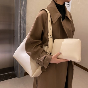 Creamy white large capacity tote bag with matching pouch and adjustable shoulder strap