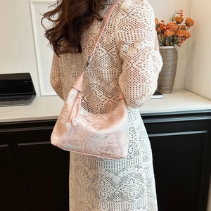 Pink jacquard half-moon bag with oriental landscape embroidery and pearl charm detail
