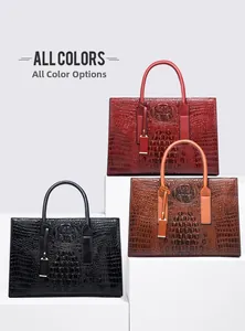 Ensemble de sacs à main motif crocodile en rouge, noir et marron sur socles blancs