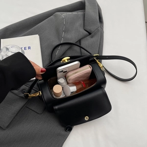 Modern black matte leather crossbody bag showing spacious interior with daily essentials