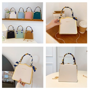 Close-up of stylish PU leather box bags with golden hardware and silk scarf handles