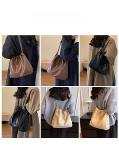 Three-color drawstring bucket bag shown on models in soft brown, black, and beige leather