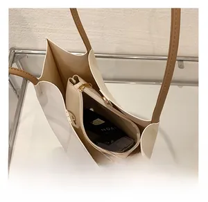 Interior view of large leather tote bag with zip pouch showing spacious storage