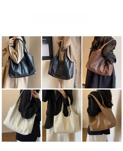 Detail view of large soft faux leather tote bag in four classic colors and textures