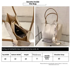 Size guide for large white tote bag with detailed capacity and strap length information