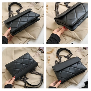 Close-up of black quilted shoulder bag with chain strap and luxury diamond pattern