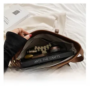 Internal view of large capacity brown tote bag showing spacious storage for daily items