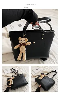 Detailed views of a black large-capacity tote bag with detachable strap and bear charm