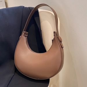 Minimalist brown leather hobo bag for women with a vintage crescent shoulder design