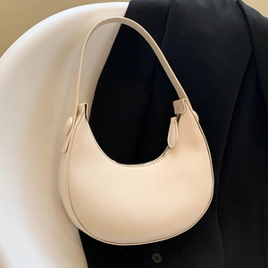 Chic cream half-moon underarm bag in premium faux leather with wide shoulder strap