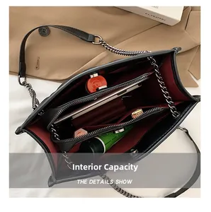 Internal view showing large capacity and multi-layer storage of the black quilted bag