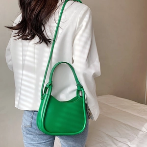 Minimalist green semi-circle shoulder bag with knot handle for women in trendy style