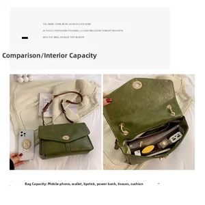 Detail view of forest green leather bag interior compartments with a gold twist lock