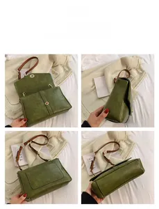 Detail view showing green PU leather crossbody bag with gold-tone buckle and inner space