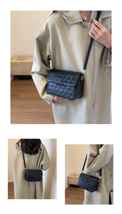 Close-up of 3D geometric embossed pattern on a black PU leather crossbody square bag