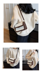Detail of vintage square crossbody bag with 3D geometric embossed pattern and gold hardware