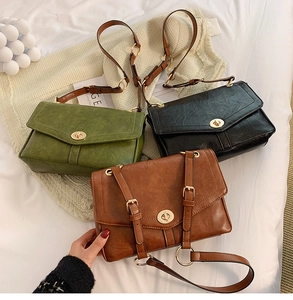 Detailed display of retro crossbody bags in green, black, and brown with metal locks