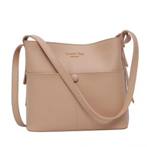 Minimalist beige synthetic leather bucket bag with an adjustable crossbody strap