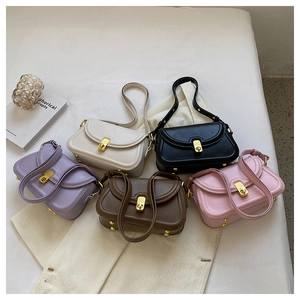Detailed collection of colorful small square bags with golden twist locks and metal feet