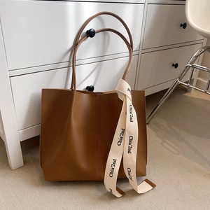 Minimalist large capacity brown leather tote bag with decorative printed ribbon handle