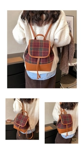 Detail view of plaid fabric and brown leather stitching on a mini vintage backpack