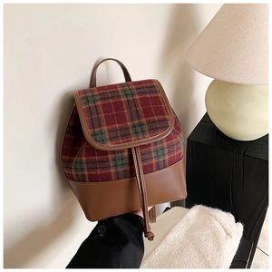 Detail of plaid PU leather backpack with drawstring closure and vintage retro pattern