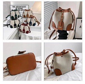 Detail showing various colors of contrast canvas bucket bags with leather stitching