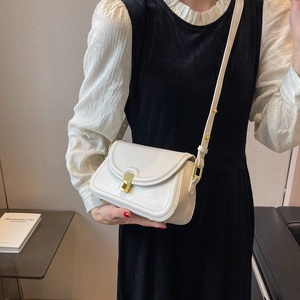 Chic white small crossbody bag for women with gold twist lock and adjustable strap