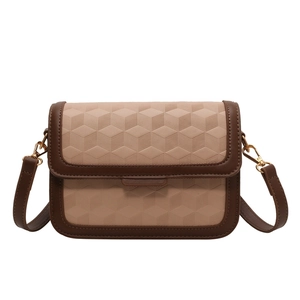 Chic two-tone geometric embossed crossbody bag with adjustable brown leather strap
